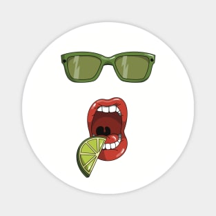 Mouth about to eat a slice of a green lime and matching green sun glasses Magnet